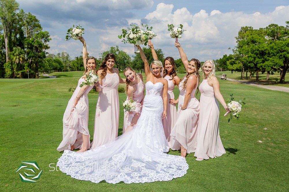 bride and bridesmaids on golf course steven miller photography