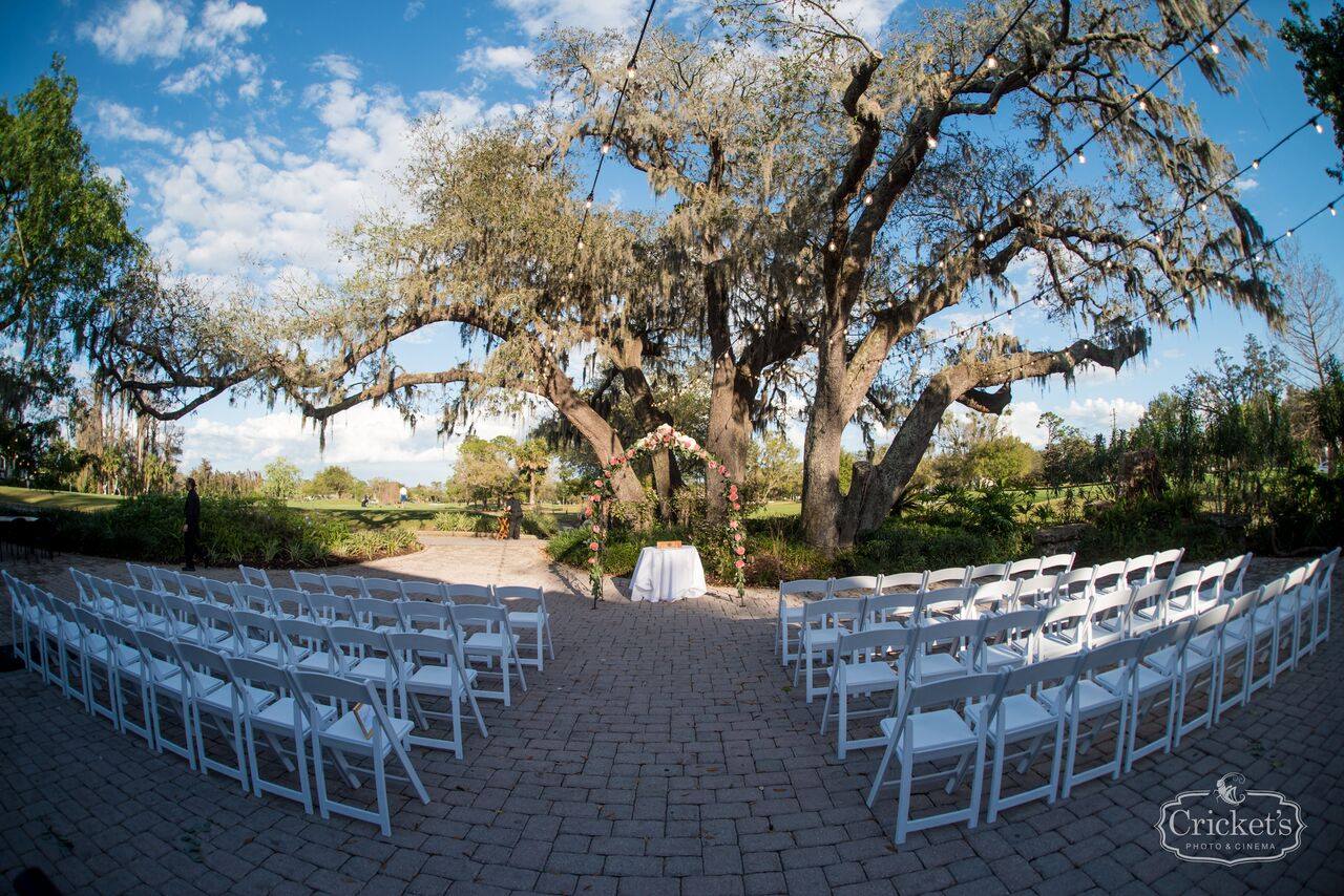 ceremony seating under a large oak tree